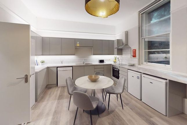 A Modern And Spacious Kitchen With Ample Natural l...