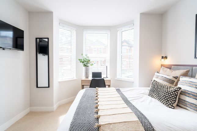 Bright And Spacious Master Bedroom Featuring A Com...