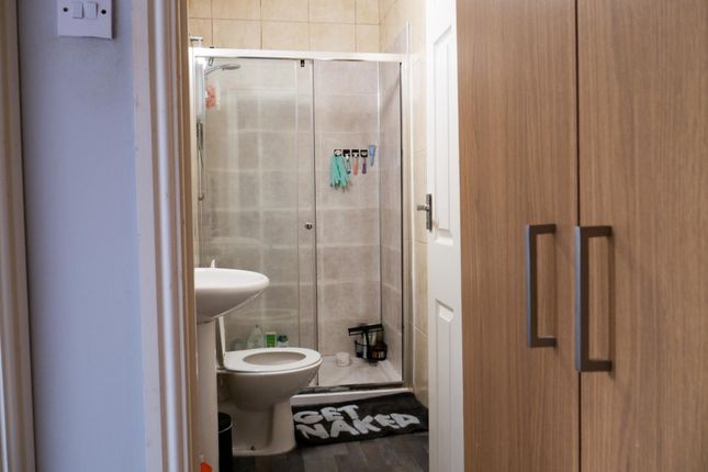 A Clean And Well-Maintained Bathroom With A Toilet...