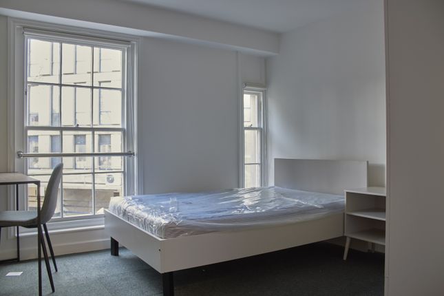 A Bright And Tidy Double Bedroom With A Modern Des...