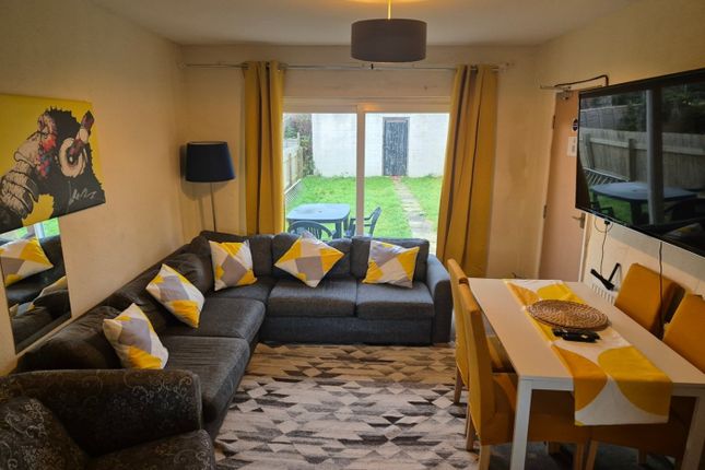 A Spacious And Inviting Modern Living Room With Am...