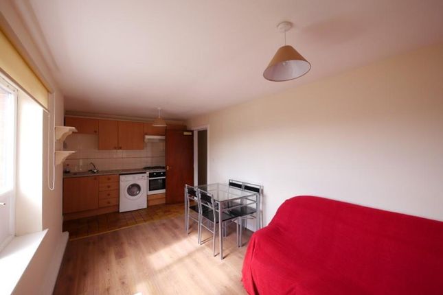 A Bright And Tidy Living Space Featuring A Compact...