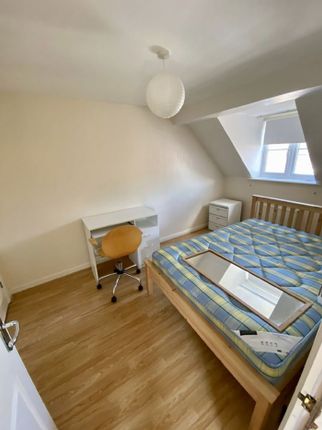 Charming Double Bedroom Featuring A Cozy Layout Wi...