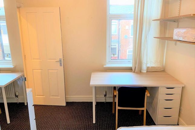 This Spacious Double Bedroom Features Ample Natura...