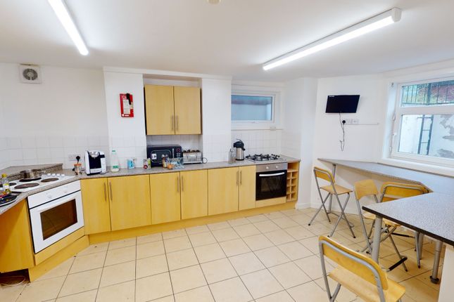 Bright And Spacious Kitchen Featuring Ample Cabine...