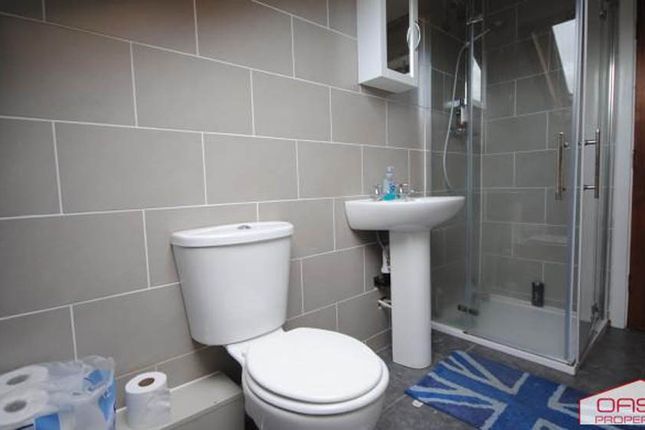 A Clean, Modern Bathroom Featuring A Large Shower,...