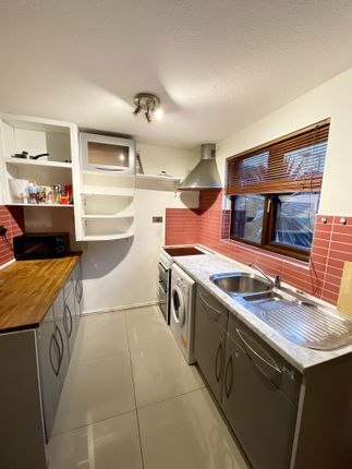 A Bright And Tidy Kitchen With Modern Appliances, ...