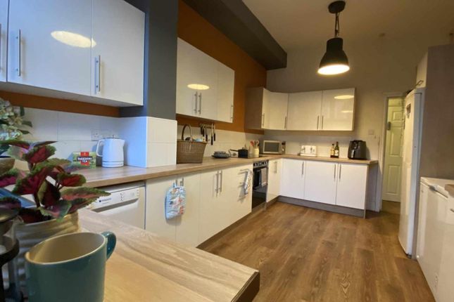Bright, Modern Galley Kitchen With White Cabinets,...