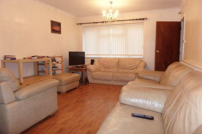 A Spacious And Inviting Living Room Featuring Comf...