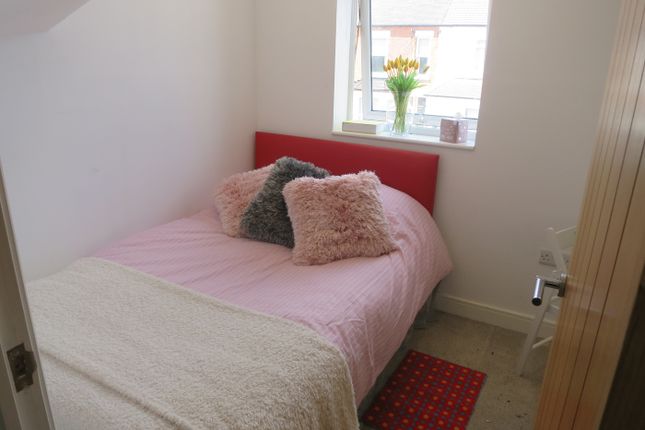 A Cozy Double Bedroom Featuring A Comfortable Bed ...