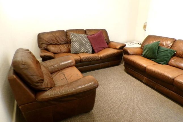 A Cozy Living Room Featuring Comfortable Leather S...