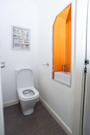 A Bright And Modern Single Toilet Featuring A Slee...