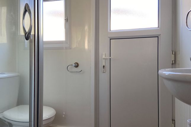 Bright And Clean Bathroom Featuring A Toilet, A Si...