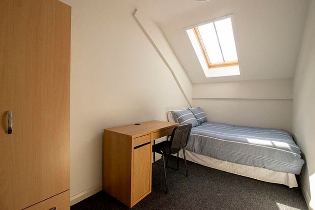 A Cozy Double Bedroom Featuring A Comfortable Bed ...