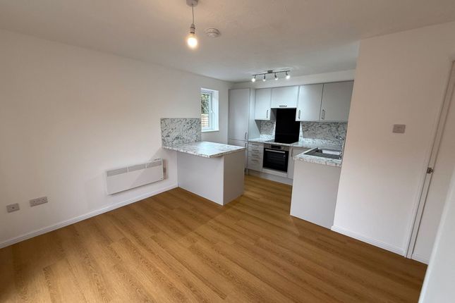 Modern Kitchen Featuring Sleek White Cabinets, Mar...