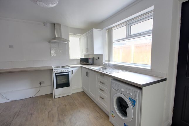 A Bright And Tidy Kitchen Equipped With Modern App...