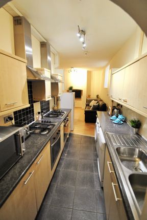 A Modern Kitchen Featuring Sleek Cabinetry, Ample ...