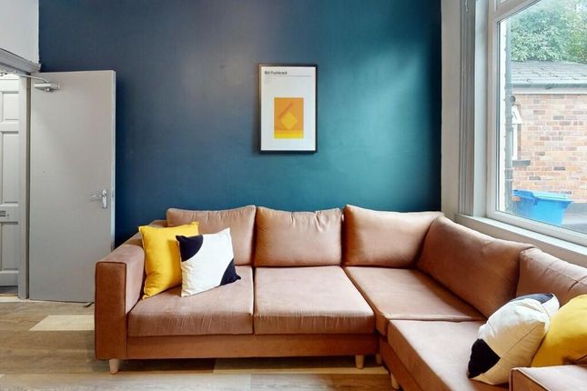 A Modern Living Room Featuring A Stylish L-Shaped ...