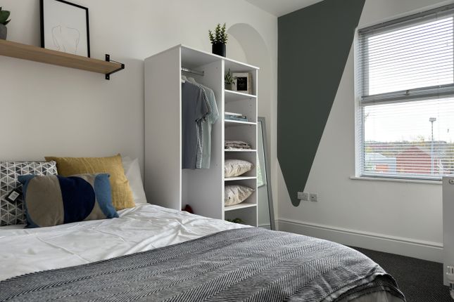 A Bright And Inviting Double Bedroom Featuring Sty...