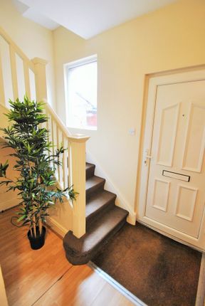 Welcoming Hallway Featuring Natural Light And Styl...