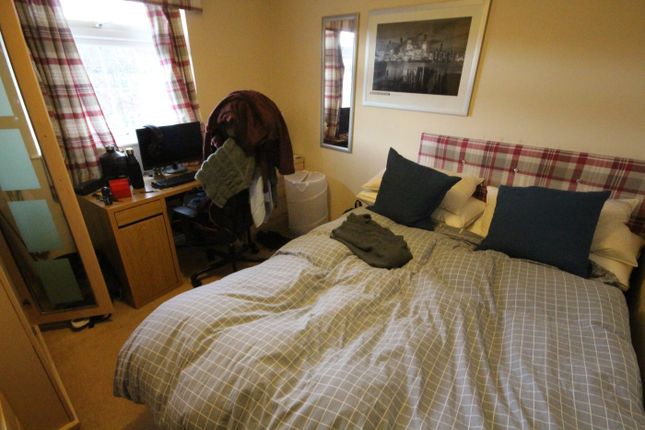A Cozy Double Bedroom Featuring Comfortable Beddin...