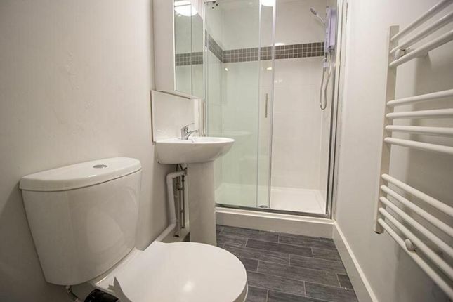 A Modern Bathroom Featuring A Sleek Shower, Contem...