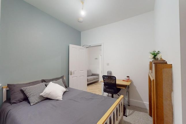 A Cozy And Inviting Double Bedroom With A Stylish ...