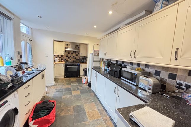 A Bright And Well-Organized Kitchen With Modern Ap...