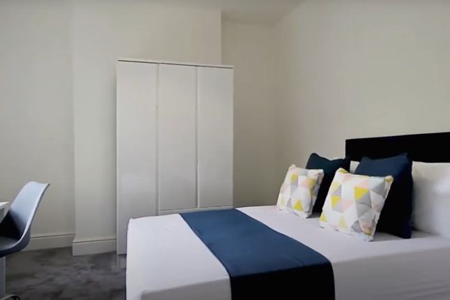 Bright And Modern Master Bedroom Featuring A Comfo...
