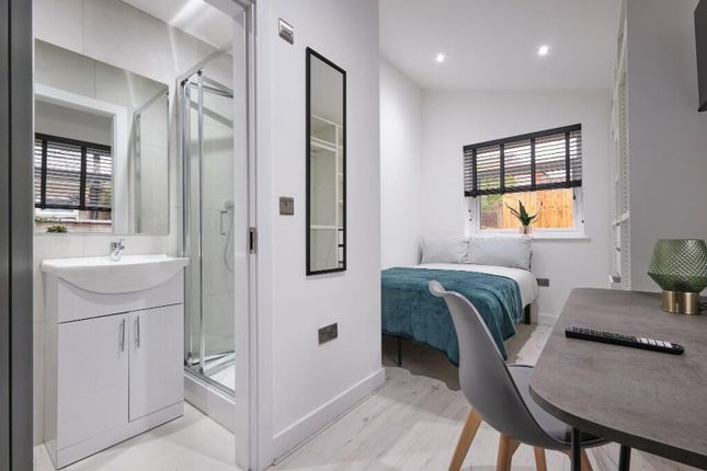 A Modern And Inviting Double Bedroom With An Ensui...