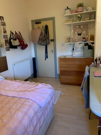 A Cozy Double Bedroom Featuring A Comfortable Bed ...