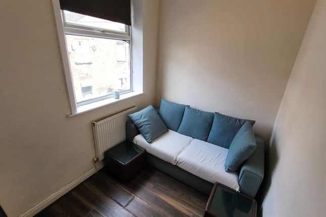 Bright And Inviting Living Room Featuring A Comfor...