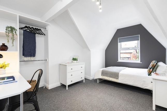 Bright And Airy Student Bedroom Featuring A Spacio...