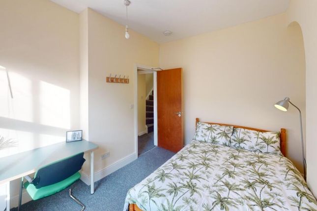A Bright And Inviting Double Bedroom Featuring A c...