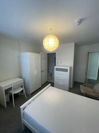 Bright And Tidy Master Bedroom Featuring A Double ...