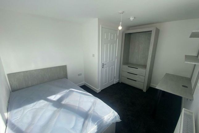 Bright And Modern Master Bedroom Featuring A Doubl...