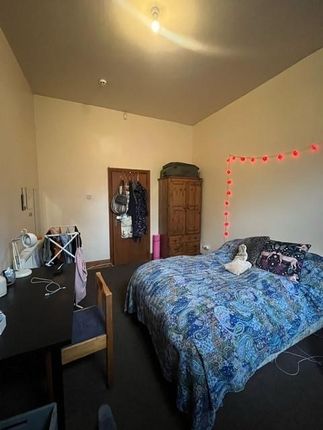 A Cozy Double Bedroom Featuring A Comfortable Bed ...