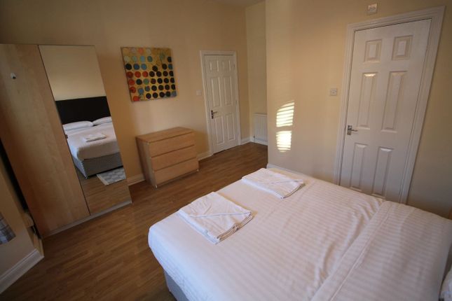 This Inviting Double Bedroom Features A Spacious l...