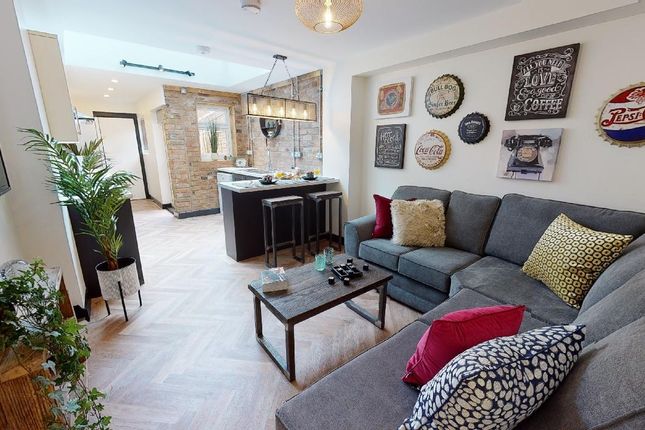 A Spacious, Well-Lit Living Room With Contemporary...