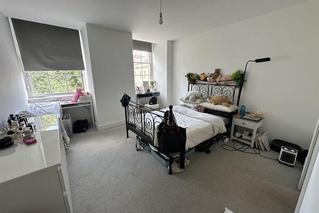 A Bright And Airy Master Bedroom Featuring A Large...
