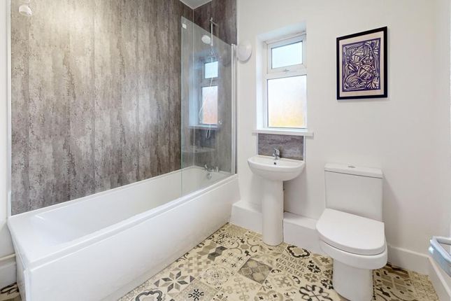 A Spacious And Modern Bathroom Featuring A Stylish...
