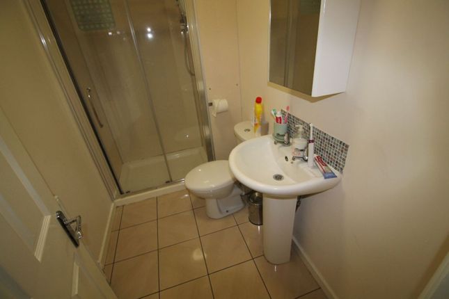 This Well-Maintained Bathroom Features A Modern Sh...