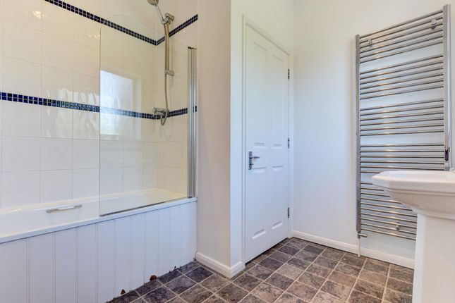A Spacious And Well-Maintained Bathroom Featuring ...