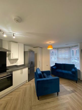 Bright And Welcoming Living Room Featuring A Large...