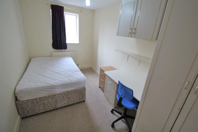 A Small, Clean Bedroom With A Single Bed, A Window...