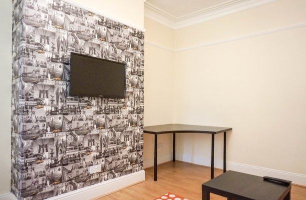 A Well-Maintained Living Room Featuring A Striking...