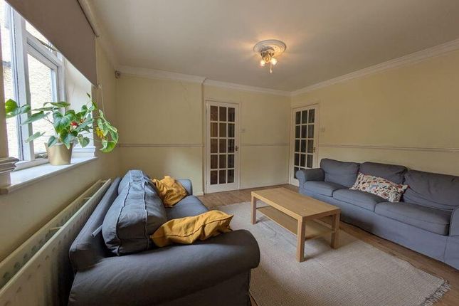 A Cozy And Well-Maintained Living Room Featuring T...