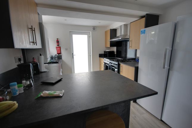 A Bright And Modern Kitchen With Ample Storage And...
