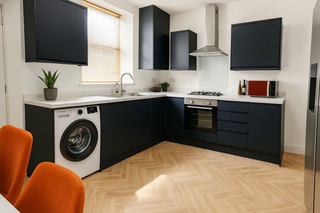 Modern Kitchen With Sleek Navy Cabinets, A Large W...