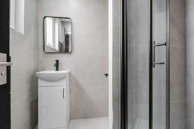 Modern And Clean Bathroom With A Compact White Sin...
